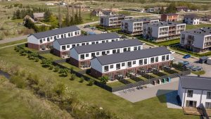 Būsimo kotedžų projekto vizualizacija įstatyta į nuotrauką